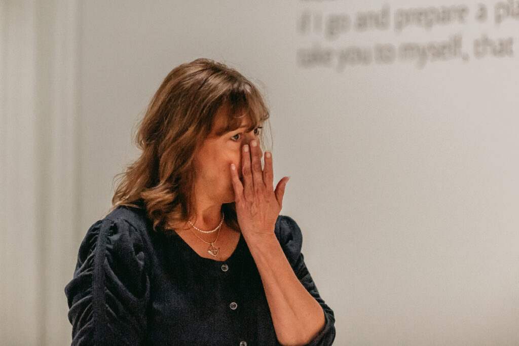 Janai overcome with emotion at Beloved Gallery while reflecting on Akiane Kramarik’s art.