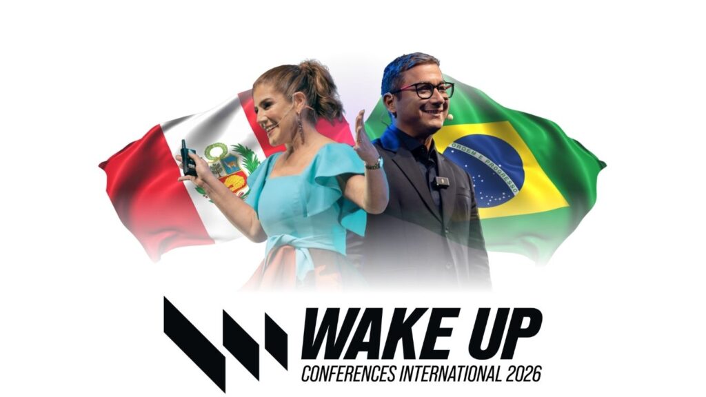 A woman and a man stand smiling in front of Peruvian and Brazilian flags. WAKE UP Conferences International 2026 is written below them with a bold black logo.